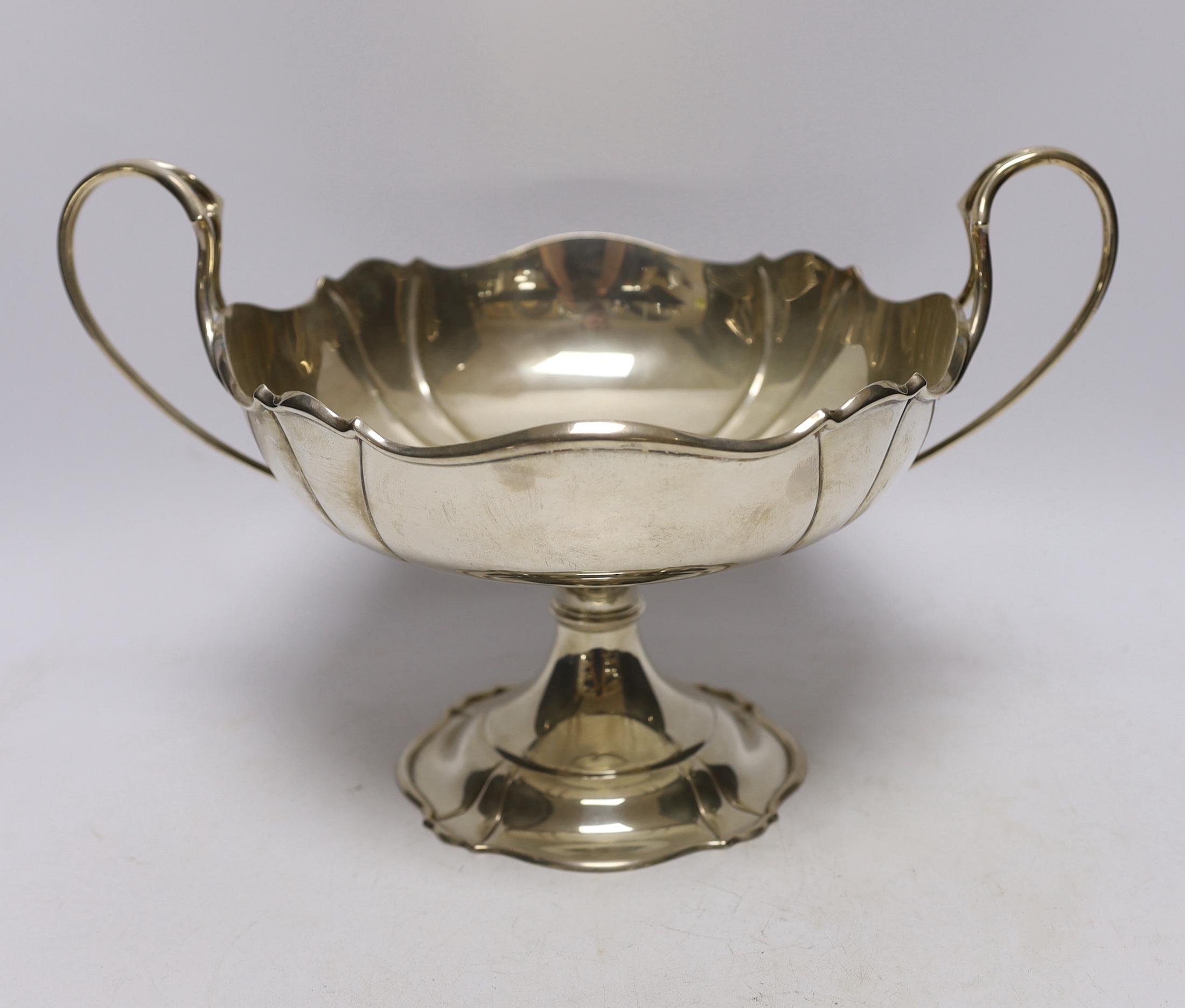 A George V silver two handled pedestal fruit bowl, by Atkin Brothers, Sheffield, 1911, 32.6cm over handles, 26oz.